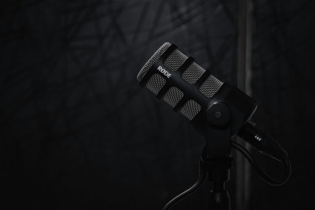 High-quality close-up of a Rode PodMic on a stand, perfect for podcast and audio recording setups.